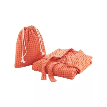 Peignoir de bain terracotta en coton biologique présenté dans un jolie sac avec un cordon