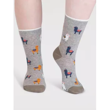 Chaussettes durables avec design de lamas et fleurs en coton biologique.